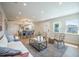 Open-concept living space with hardwood floors seamlessly connects living room, dining area and kitchen at 1102 N Albany Ave, Tampa, FL 33607