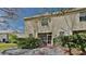 Private backyard featuring a screened patio, stone landscaping, and lush greenery at 12426 Country White Cir, Tampa, FL 33635