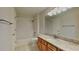 Well-lit bathroom featuring granite countertops, a tub-shower combo, and updated fixtures at 12426 Country White Cir, Tampa, FL 33635