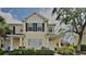Charming two-story townhouse with a yellow facade and well-maintained landscaping at 12426 Country White Cir, Tampa, FL 33635