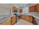 Well-equipped kitchen with stainless steel appliances, granite countertops, and tile flooring at 12426 Country White Cir, Tampa, FL 33635
