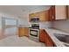 Modern kitchen with granite countertops, stainless steel appliances, and ample cabinet space at 12426 Country White Cir, Tampa, FL 33635