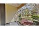 Relaxing screened patio offering views of the landscaped backyard and surrounding greenery at 12426 Country White Cir, Tampa, FL 33635