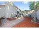 Spacious backyard patio with privacy fence, landscaping, and access to the home at 12605 Catamaran Pl, Tampa, FL 33618