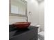 Modern powder room with a unique vessel sink and black granite countertop for a stylish touch at 12605 Catamaran Pl, Tampa, FL 33618