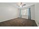 A cozy bedroom featuring neutral walls and natural light at 12605 Catamaran Pl, Tampa, FL 33618