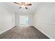 A bright bedroom featuring fresh paint and trim with an additional sitting room at 12605 Catamaran Pl, Tampa, FL 33618