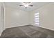 A light and airy bedroom with neutral walls and carpet at 12605 Catamaran Pl, Tampa, FL 33618
