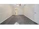 A bright bedroom featuring fresh paint and trim and an open walk-in closet at 12605 Catamaran Pl, Tampa, FL 33618