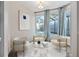 Staged sitting room featuring a bay window with views of the screened-in pool area at 12605 Catamaran Pl, Tampa, FL 33618