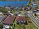 Aerial view of backyard, neighborhood and lake nearby showing convenient access to local waterways at 12802 Lake Vista Dr, Gibsonton, FL 33534