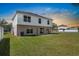 Spacious backyard featuring green grass and a patio, perfect for outdoor enjoyment at 12802 Lake Vista Dr, Gibsonton, FL 33534