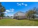 A sprawling backyard showcases the home's serene setting and outdoor potential at 12802 Lake Vista Dr, Gibsonton, FL 33534