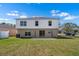 Spacious backyard features a patio, lush lawn, and easy access to the house via sliding glass doors at 12802 Lake Vista Dr, Gibsonton, FL 33534