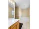 Bright bathroom featuring a soaking tub and a vanity with a white countertop at 12802 Lake Vista Dr, Gibsonton, FL 33534
