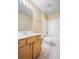 Bathroom with a wooden vanity, a bright mirror, and a shower-tub combination at 12802 Lake Vista Dr, Gibsonton, FL 33534