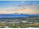 Picturesque view of a city skyline over the water, complemented by the natural landscape at 12802 Lake Vista Dr, Gibsonton, FL 33534