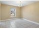 Cozy dining area with a large window, offering natural light and tile flooring at 12802 Lake Vista Dr, Gibsonton, FL 33534