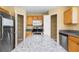Kitchen showcases stainless appliances, granite countertops, pantry and a central island at 12802 Lake Vista Dr, Gibsonton, FL 33534