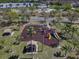 Playground includes mulch base, slides, swings, covered picnic tables and palm trees for shading at 12802 Lake Vista Dr, Gibsonton, FL 33534