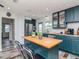 Modern kitchen featuring an island with seating and stainless steel appliances with lots of cabinet space at 1528 W River Shore Way, Tampa, FL 33603