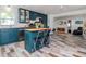 Stylish kitchen featuring an island with seating, stainless steel appliances, and a view into the living area at 1528 W River Shore Way, Tampa, FL 33603