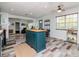 Inviting open-concept home featuring a modern kitchen island and stylish flooring at 1528 W River Shore Way, Tampa, FL 33603