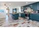 Well-lit kitchen features a center island, stainless steel appliances, and stylish flooring at 1528 W River Shore Way, Tampa, FL 33603