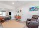 Cozy living room showcases a wooden console, rocking chair, and stylish decor at 1528 W River Shore Way, Tampa, FL 33603