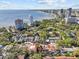 Charming aerial view of townhomes showcasing its proximity to the bay and city skyline at 2537 W Maryland Ave, Tampa, FL 33629