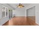 Bright living room featuring wood-look floors, a ceiling fan, and lots of natural light at 2537 W Maryland Ave, Tampa, FL 33629