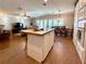 Open-concept kitchen with an island seamlessly flowing into the living and dining areas at 272 S Port Royal Ln, Apollo Beach, FL 33572