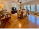 Cozy living room featuring hardwood floors, vaulted ceilings, and natural light at 272 S Port Royal Ln, Apollo Beach, FL 33572