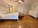 Bright main bedroom with hardwood floors, neutral decor, and a spacious closet at 272 S Port Royal Ln, Apollo Beach, FL 33572