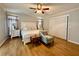 Serene main bedroom with hardwood floors, neutral decor, and ample natural light at 272 S Port Royal Ln, Apollo Beach, FL 33572