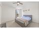 Bedroom with a ceiling fan, natural light, and carpeted floors at 2944 Billingham Dr, Land O Lakes, FL 34639