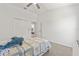 Cozy bedroom with a ceiling fan, a plush toy, and a neutral color scheme at 2944 Billingham Dr, Land O Lakes, FL 34639