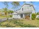 Charming two-story home with a manicured lawn, mature trees, and an attached two-car garage at 2944 Billingham Dr, Land O Lakes, FL 34639