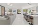 Open-concept living area with a sleek kitchen island and a comfortable seating area, perfect for entertaining at 2944 Billingham Dr, Land O Lakes, FL 34639