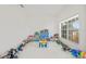 Spacious playroom with tile flooring, lots of toys, and large windows for natural light at 2944 Billingham Dr, Land O Lakes, FL 34639