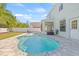Beautiful pool and backyard, with a white privacy fence surrounding the property at 2944 Billingham Dr, Land O Lakes, FL 34639