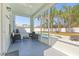 Screened porch area overlooking the pool and backyard at 2944 Billingham Dr, Land O Lakes, FL 34639