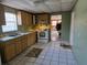 A view of the kitchen featuring wood cabinets and a white stove at 3008 Thelma St, Tampa, FL 33605