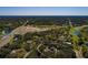 A sprawling home and lush landscape viewed from above on a sunny day at 3030 Cedar Trce, Tarpon Springs, FL 34688