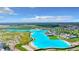 Aerial view showcasing the lagoon and waterslides in a residential neighborhood at 30753 Penny Surf Loop, Wesley Chapel, FL 33545