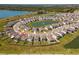 Aerial view features a home's location with a pond and surrounding neighborhood, ideal for buyers at 30753 Penny Surf Loop, Wesley Chapel, FL 33545