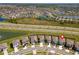 Aerial view of a neighborhood highlighting the community's layout and proximity to a roadway at 30753 Penny Surf Loop, Wesley Chapel, FL 33545