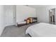 Bedroom with a crib, accent seating, and plenty of natural light at 30753 Penny Surf Loop, Wesley Chapel, FL 33545