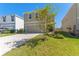 Two-story home showcasing a neutral color scheme, well-kept lawn, and a spacious two-car garage at 30753 Penny Surf Loop, Wesley Chapel, FL 33545