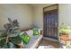 Inviting front porch with comfortable seating and charming decor, creating a welcoming entrance at 30753 Penny Surf Loop, Wesley Chapel, FL 33545